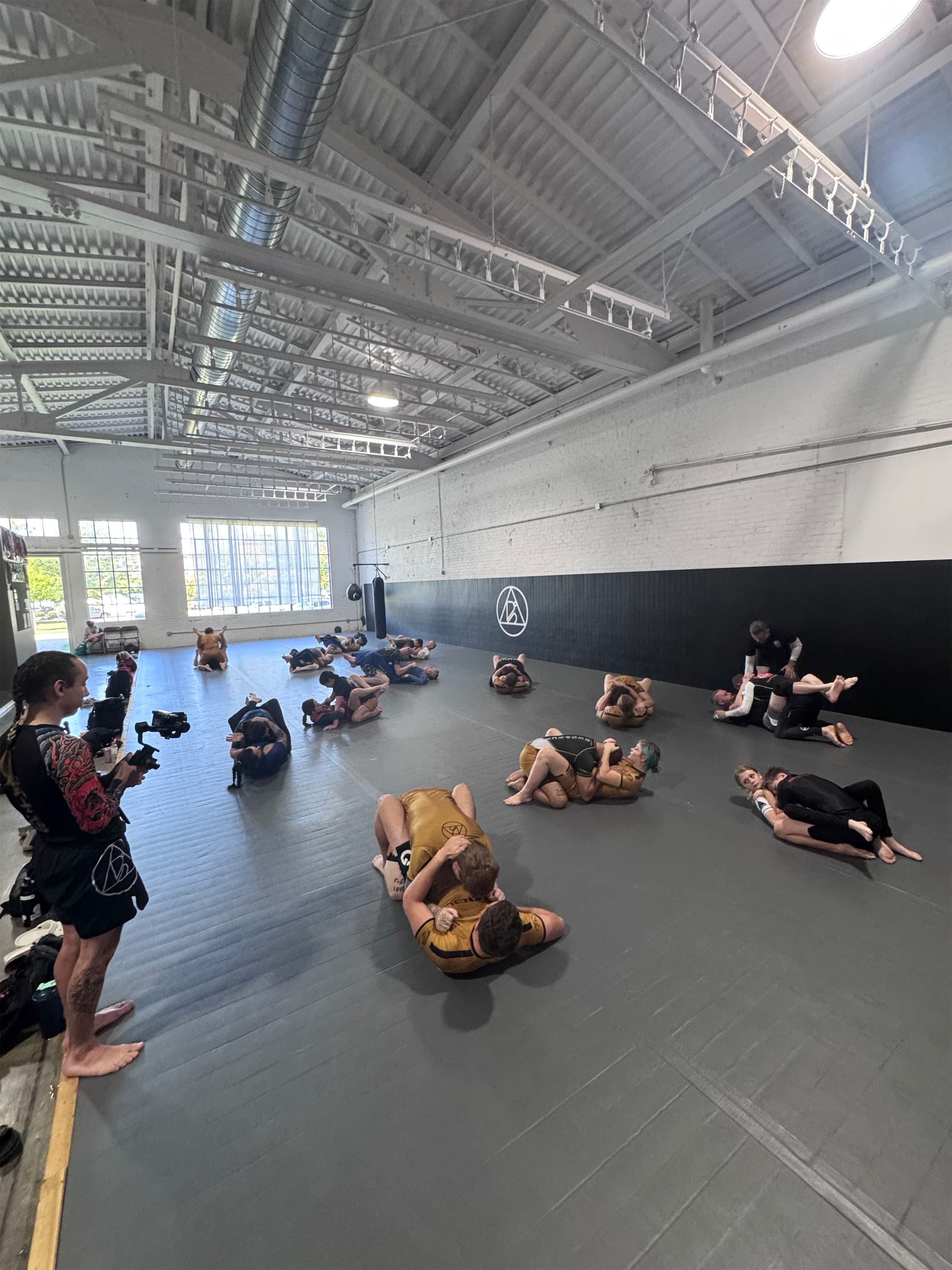 Adults training Brazilian Jiu-Jitsu at Bendu Academy